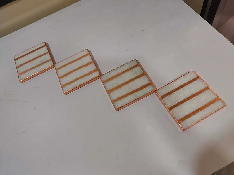 white and rose gold coasters