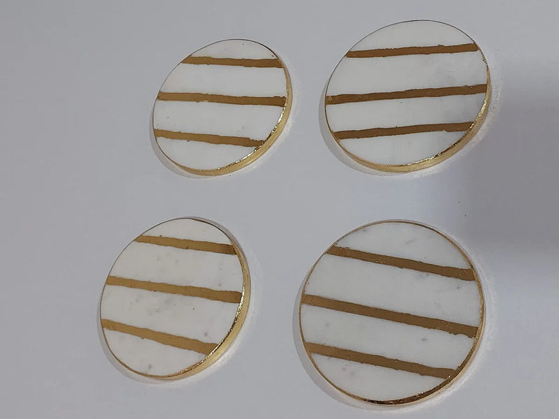bright gold and white marble coasters
